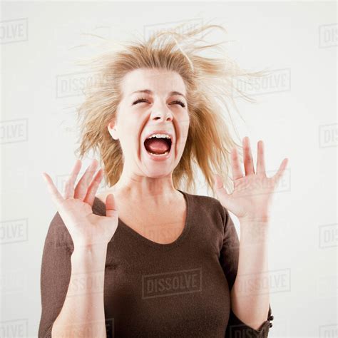 studio shot  young woman screaming stock photo dissolve