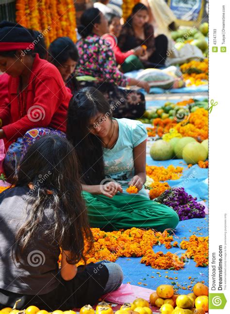 Nepalese People Make Garland For Sale At Thamel Market