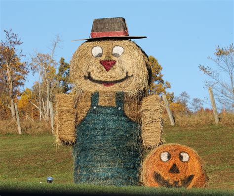 foot scarecrow     hay bales   square bales  arms hat  storage