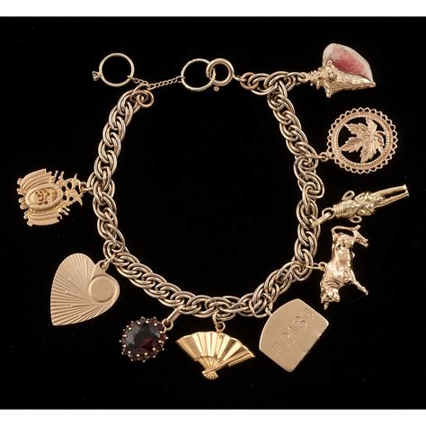 gold filled charm bracelet  gold charms cowans auction house  midwests  trusted