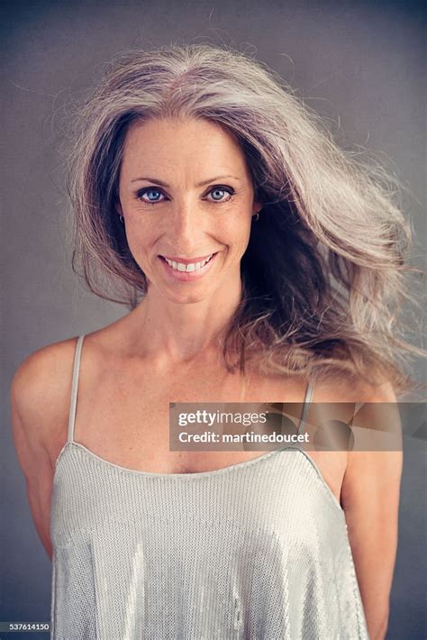 aging gracefully beautiful mature woman  silver hair  dress