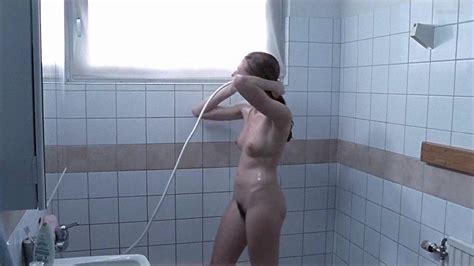 polish actress magdalena poplawska nude under shower scene from between two fires
