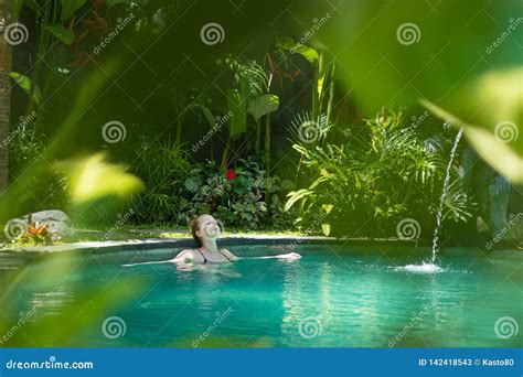 sensual young woman relaxing  outdoor spa infinity swimming pool