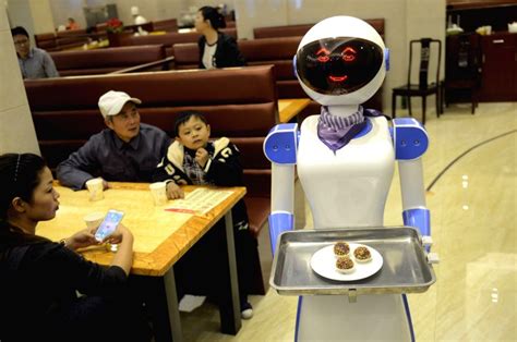 cixi china robot serves food   restaurant