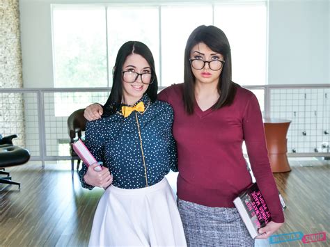 two nerdy brunettes with natural tits get banged in bed