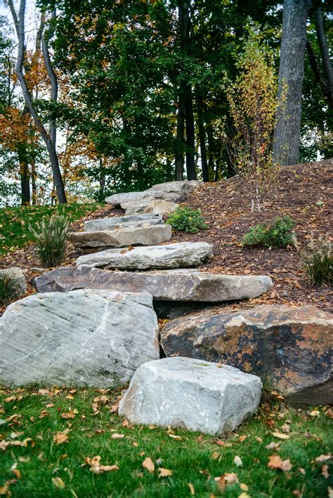 arranging  boulders   step pattern adds dimension landscaping