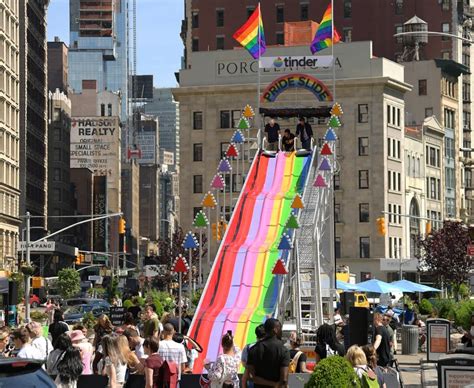 tinder celebrates world pride with 30 foot rainbow slide