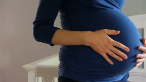 pregnant mother rubs her very big belly close up stock footage video 4883213 shutterstock