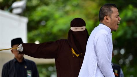 indonesian man who helped set strict adultery laws flogged