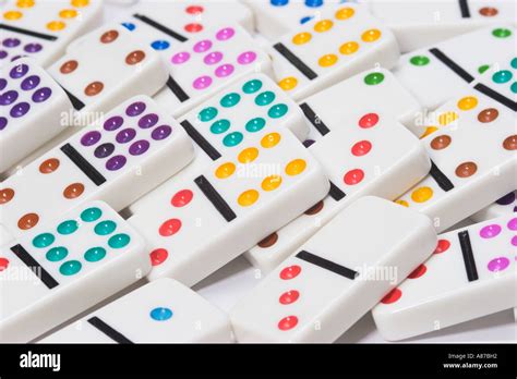 random pile  brightly colored dominoes stock photo  alamy