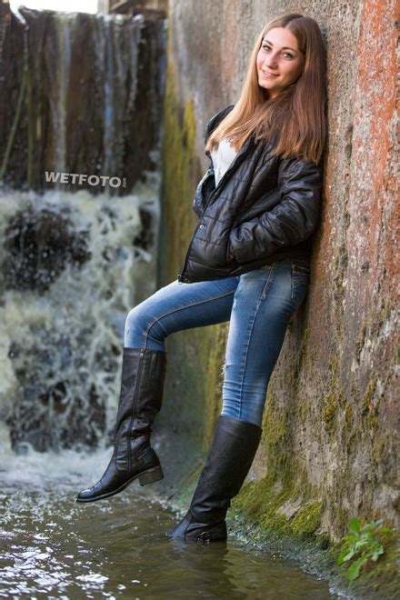 Fully Dressed Girl In Jacket Jeans And Leather Boots Get Soaking Wet