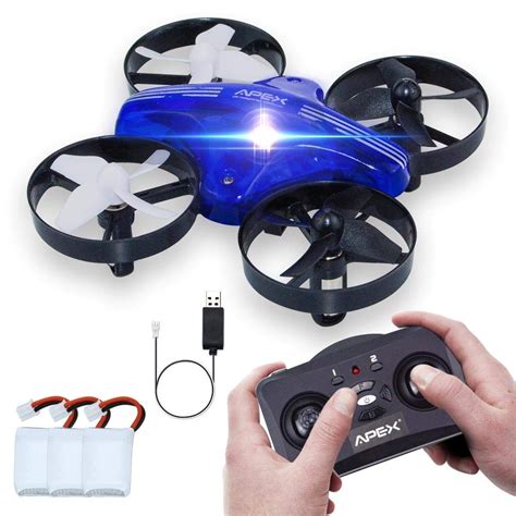 person holding  remote control device  front   blue  black flying vehicle