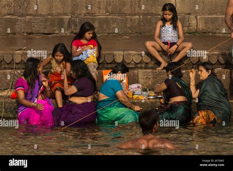 women bathing in the sacred waters of the ganges river varanasi india