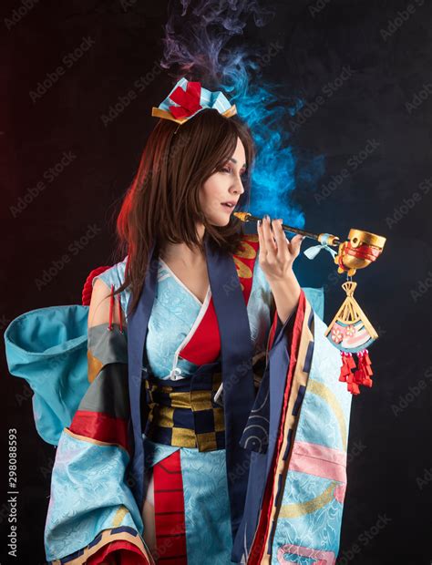 beautiful leggy busty cosplay girl wearing a stylized japanese kimono