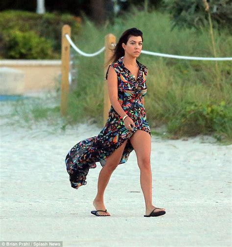 kourtney kardashian shows off her beach body as she frolics by the sea