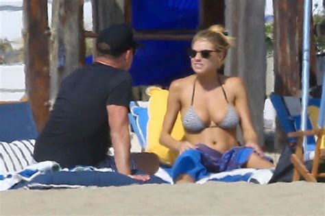 charlotte mckinney displays ample bust as she flaunts curves in sexy striped bikini celebrity