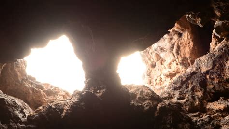 light rays shine inside of lava tube cave 4k uhd ultra hd resolution stock footage video