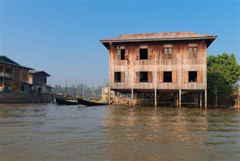 traditional stilts house  boat  water  blue sky stock photo image  burmese bamboo