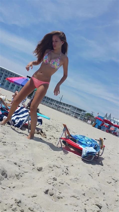 teen bikini pics of a cute brunette out on the beach