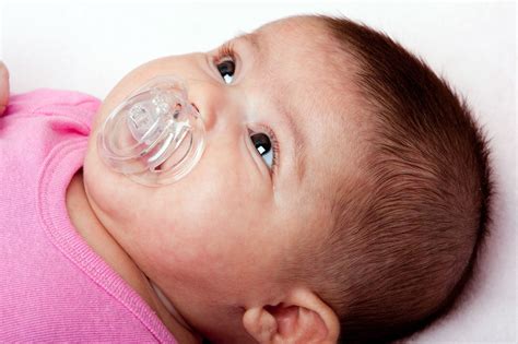 pacifiers benefits  risks   baby familydoctororg