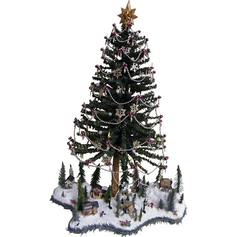 folk art table top christmas tree with winter scene at base signed