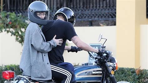 miley cyrus rides with bf cody simpson on the back of his motorcycle hollywood life