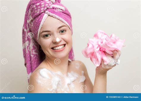 Portrait Of Smiling Girl Woman With Wet Hair Wrapped In Pink Towel