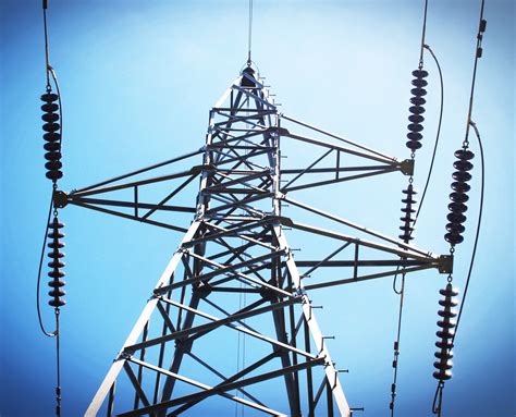 high voltage power transmission towers power lines stock photo theenergystcom