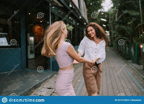 two lesbians having fun on the street stock image image of whirl