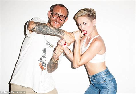 miley cyrus smokes a cigarette and grabs crotch in edgy terry