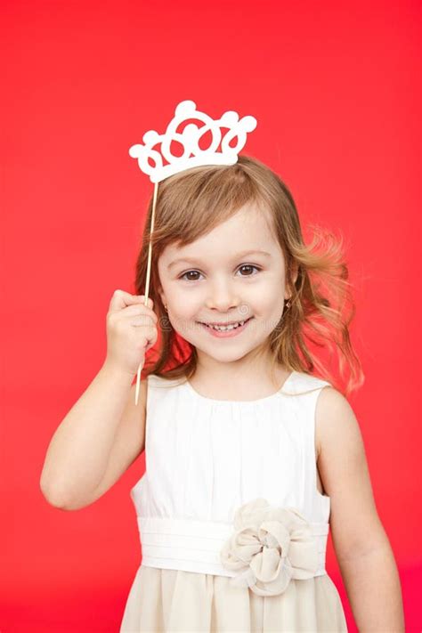young girl wearing  crown  white dress stock image image