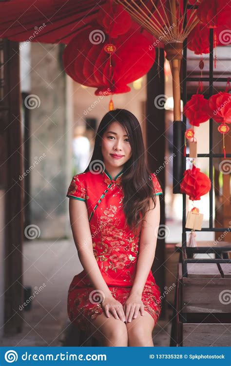 cute smiling asian chinese woman wearing cheongsam