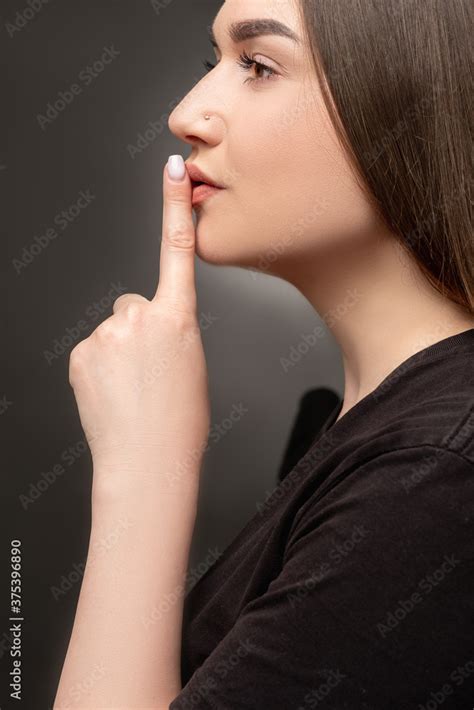 Keep Quiet Female Mystery Profile Portrait Of Woman Showing Shhh