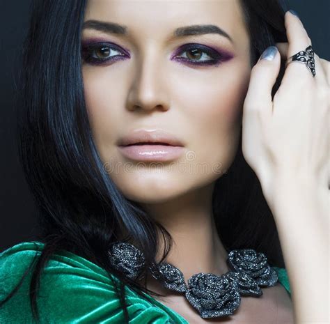 Beauty Rich Woman With Bright Makeup Wearing Luxury Jewellery On Black