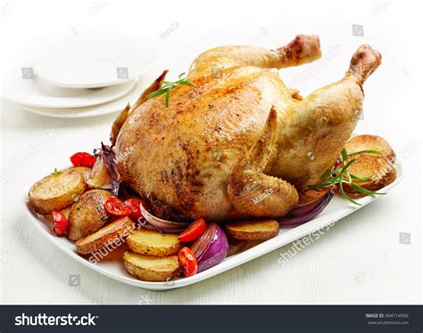 roasted chicken  white plate stock photo edit