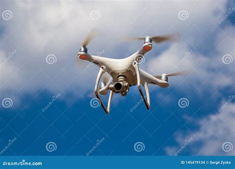 quadcopter  flight   blue sky drone stock photo image  surveillance aerial
