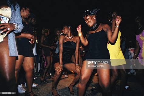 jamaica kingston group of women dancing in street night high res stock