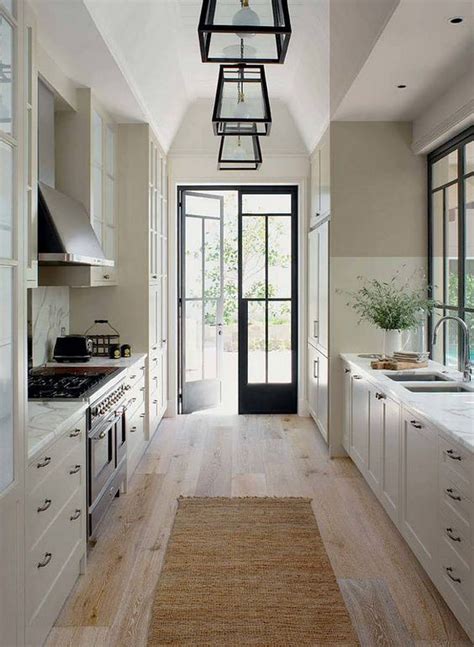 kitchen galley kitchen with wide plank floor and french doors to