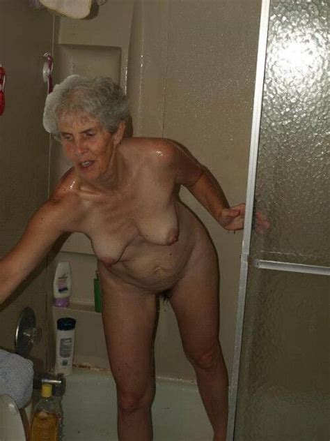 unaware mom in her bedroom or bathroom mature porn photo