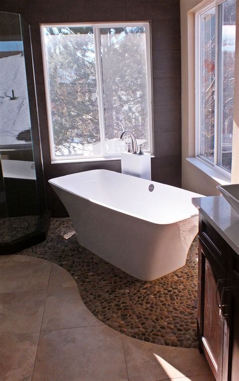 organic modern bath  freestanding tub  pebble tile