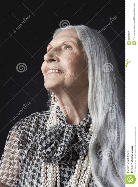 Senior Woman With Long Gray Hair Looking Up Stock