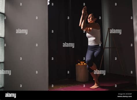 slender caucasian woman stand  yoga pose    balance