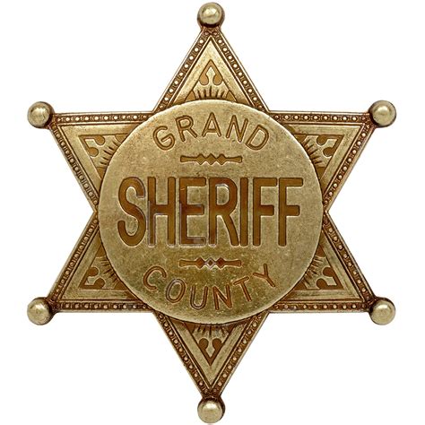 gold coloured grand county sheriff badge  denix