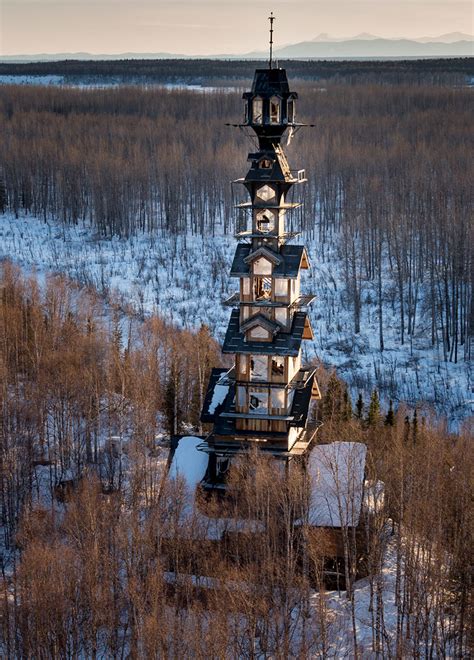 alaskan attorney builds  foot stacked log cabin tower   wilderness