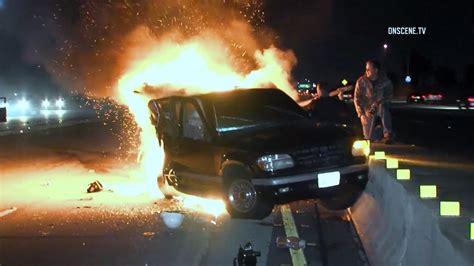 watch photojournalists rescue driver after fiery freeway crash youtube