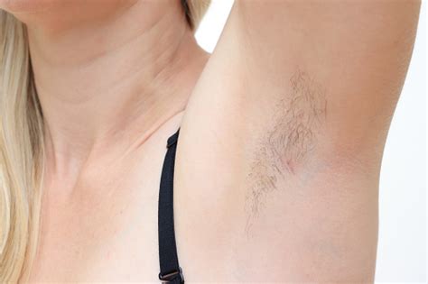 hairy unshaved anderarms armpit of a caucasian woman close