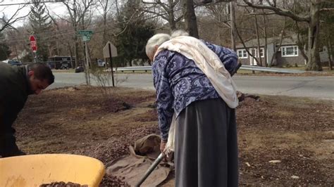 85 year old granny outworks her grandson shoveling rocks into