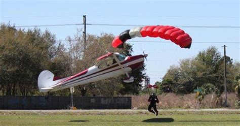 dramatic  plane strikes skydivers parachute strings