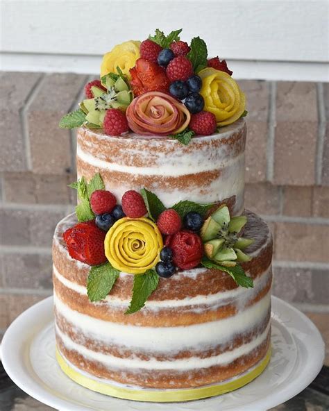 semi naked cake with fruit flowers cake by lisa herrera