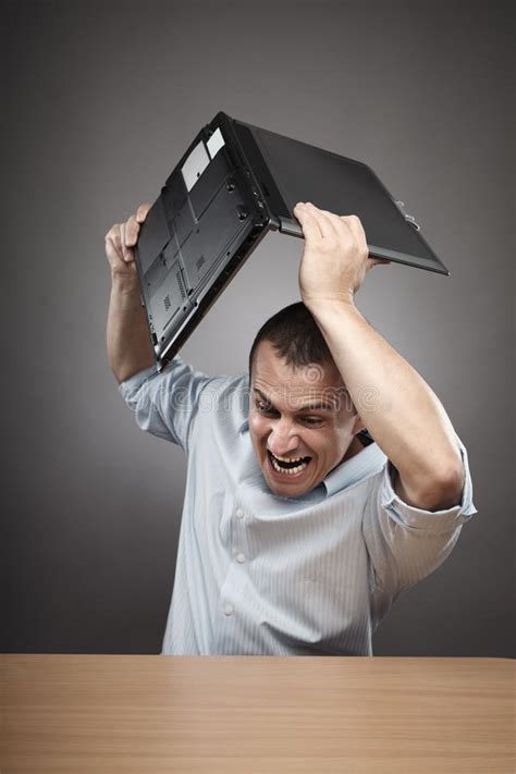 angry businessman smashing  laptop royalty  stock images image